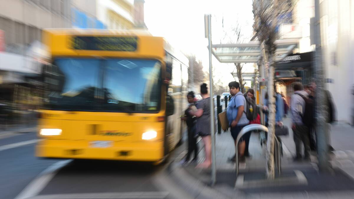 Wheels keep turning on city bus stop move