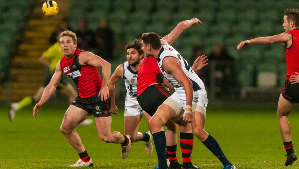  North Launceston coach Tom Couch looks to collect a centre clearance against the Bombers' old foes Launceston at UTas Stadium on Friday night. Picture: Phillip Biggs