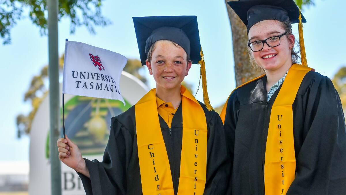 Parade: Brooks High students Riley Lawson and Chelsea Phillips gown up for the Children's University of Tasmania ceremony next month. Picture: Scott Gelston.