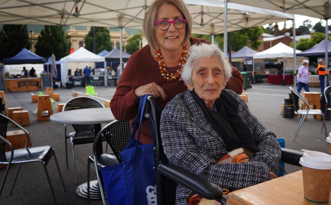 REGULAR: Trish Lawry and Ruth Lawry - sometimes known as "Nanna" -  enjoy a coffee at the market before the crowds hit. 