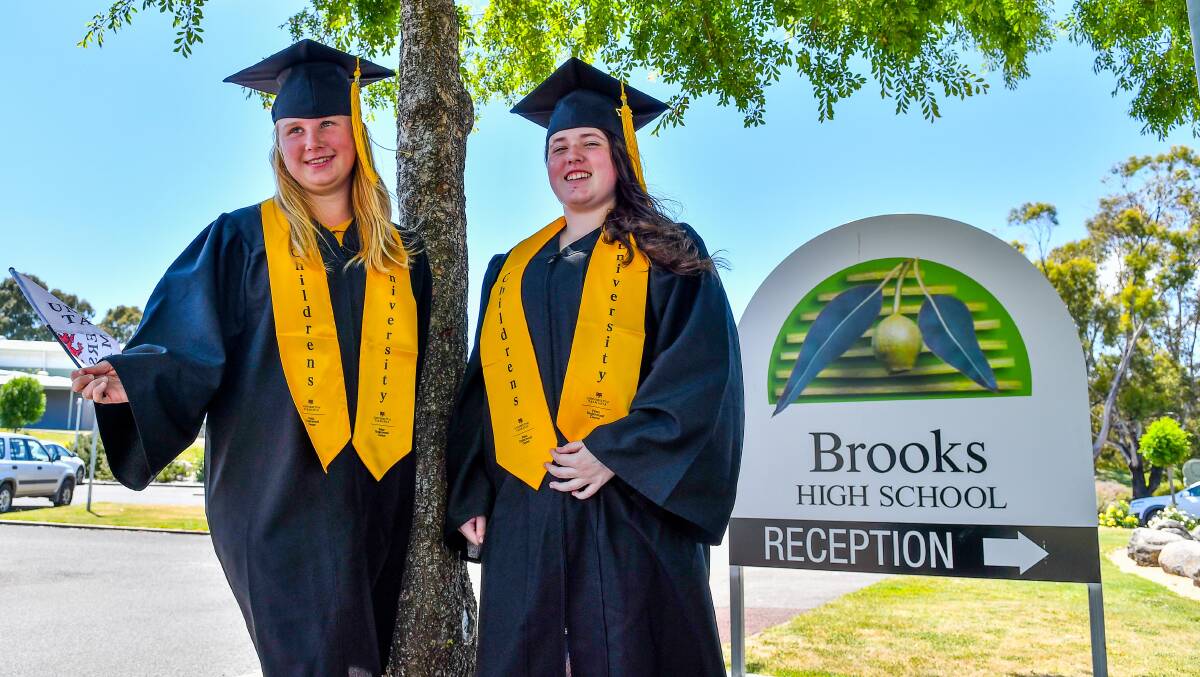 Parade: Brooks High students Haylee Humphries and Chloe Sward gown up for the Children's University of Tasmania ceremony next month. Picture: Scott Gelston.