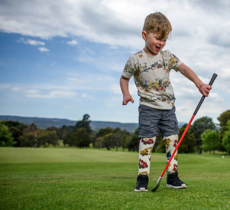 Up and about: Arthur Long, 2, plays on the Riverside Golf Club greens ahead of a charity day to raise funds for his ongoing medical treatments. Picture: Scott Gelston