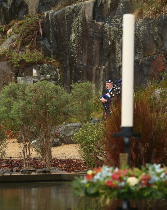 Haunting: James McAlpine from the Tasmania Police Pipe Band plays during the 20th anniversary commemoration service of the Port Arthur massacre. Picture: Getty Images.