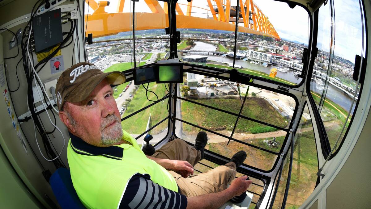 Sky-high: Crane operator Allan Dickenson at the controls of the 25 tonne tower crane at North Bank. Picture: Paul Scambler