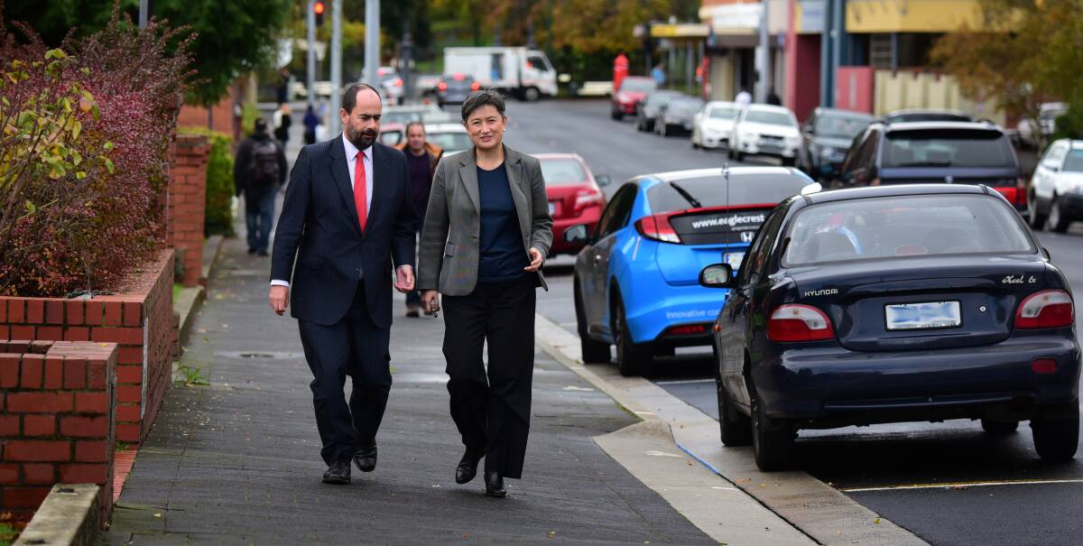 STROLLING: Bass Labor candidate Ross Hart walks along Cameron Street in Launceston with South Australian Labor senator Penny Wong. Picture: Paul Scambler.