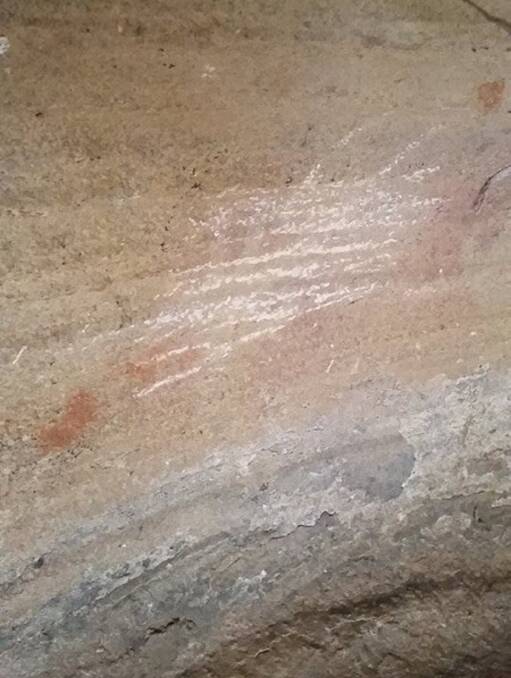 VANDALISED: Aboriginal artwork, thought to be 8000 years old, was damaged earlier this year in the state's Central Highlands. Picture: Supplied