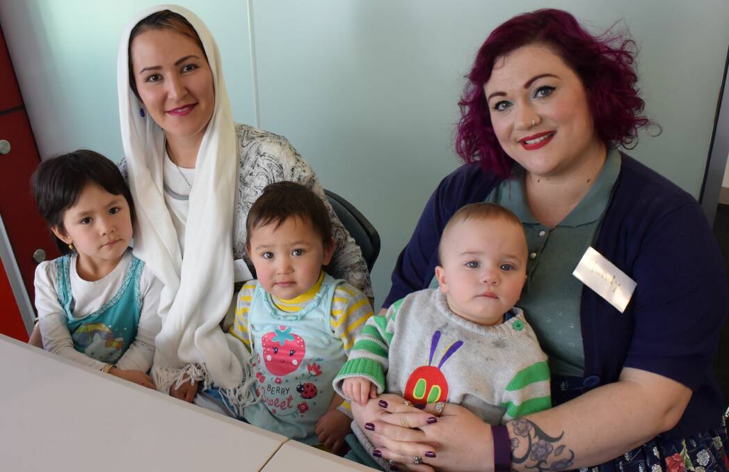 FRIENDSHIPS FORMED: Fatemeh Ebrahimi with Raha, four, and Yasaman Jafari, one, of Riverside, and Mandy and Peter Ritchie, one. Picture: Emily Baker.
