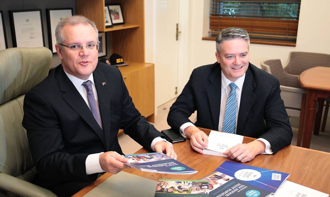 Treasurer Scott Morrison and Finance Minister Mathias Cormann with the federal budget papers at Parliament House on Tuesday evening ahead of the release of Mr Morrison's first budget.