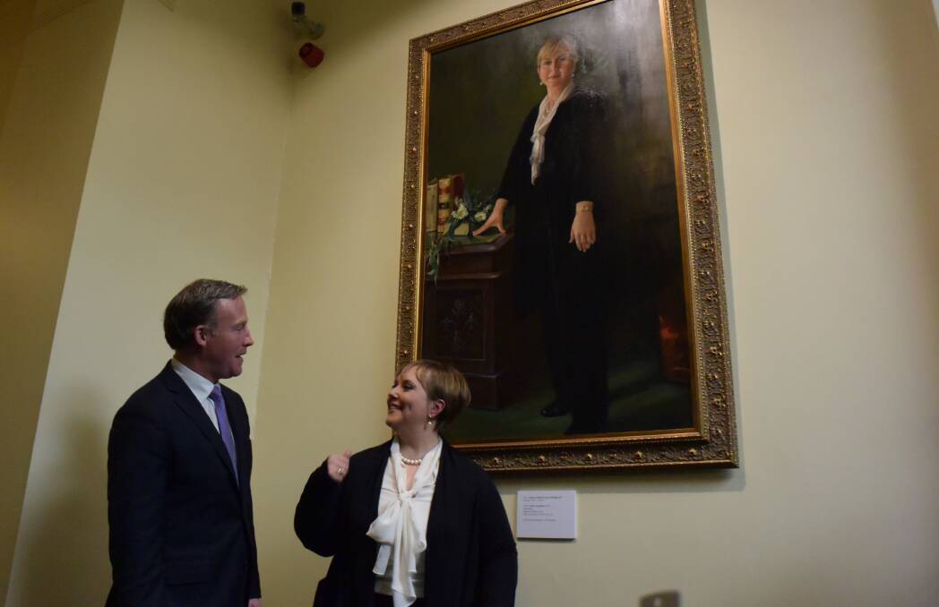 FRAMED: Former premier Lara Giddings and Premier Will Hodgman discuss Deny Christian's portrait commemorating Ms Giddings' term as Tasmania's 44th premier.