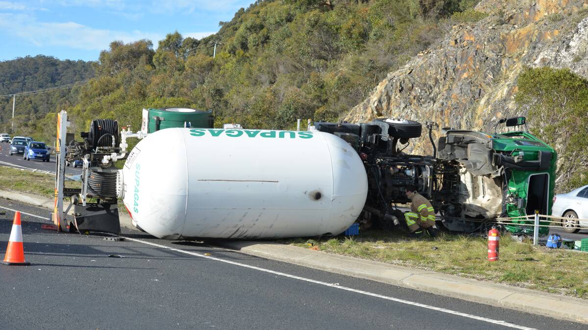 Rollover: The scene of the truck rollover at Round Hill on Monday morning. Picture: Brodie Weeding.