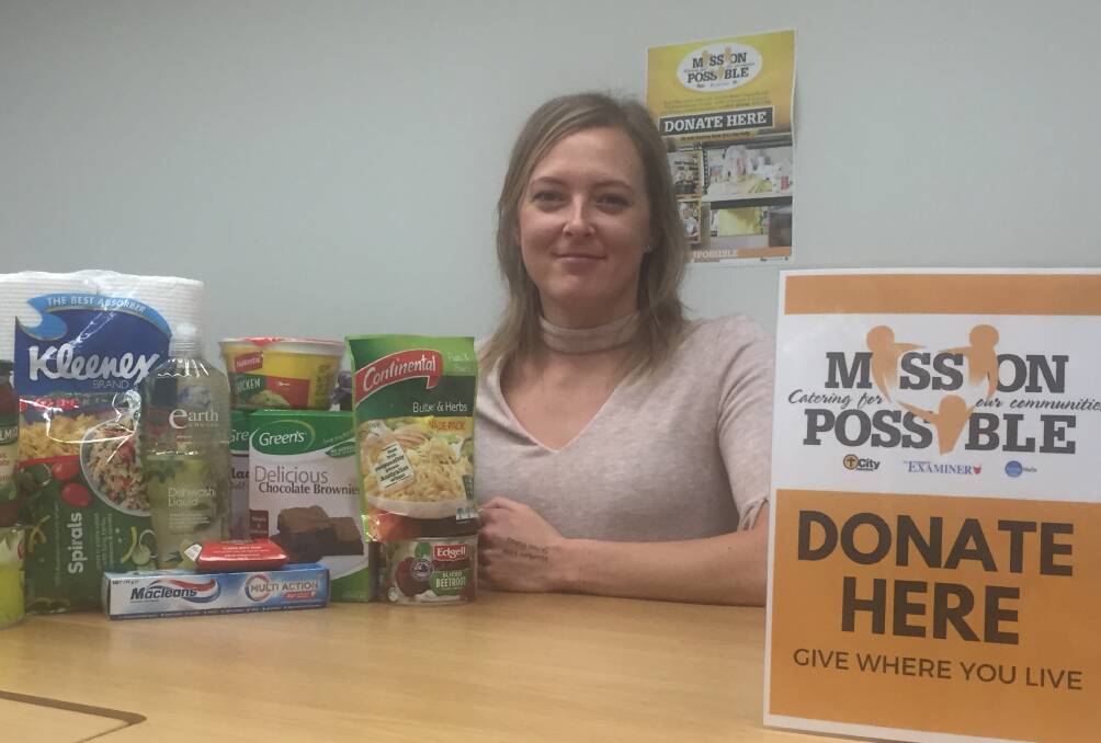 KIND: The Examiner's marketing manager Ashton Whiley with some of the products donated during week one of the Mission Possible campaign.