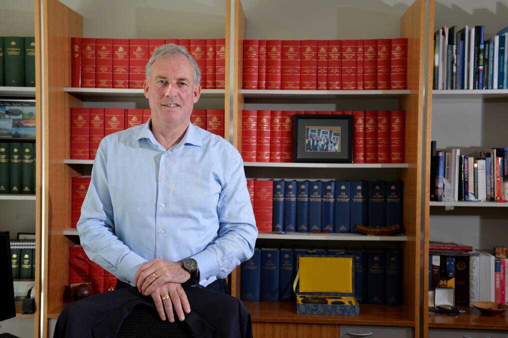 Former Senator and Tourism Minister, Richard Colbeck in his Devonport office. 