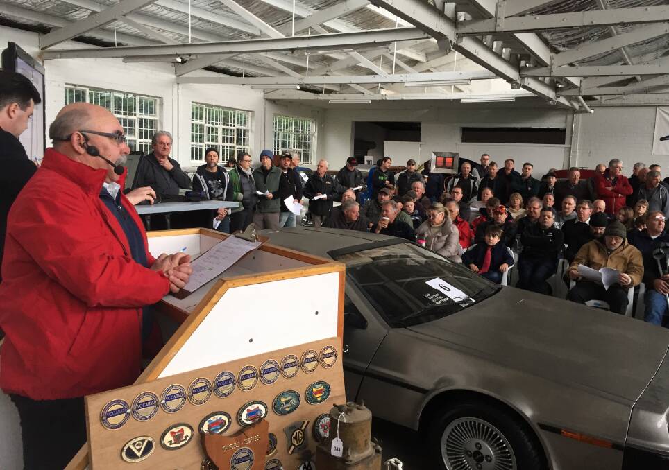 SELLER: Hundreds of people packed Tullochs Auctions on Saturday for the collector car auction event. Picture: Hayden Johnson 