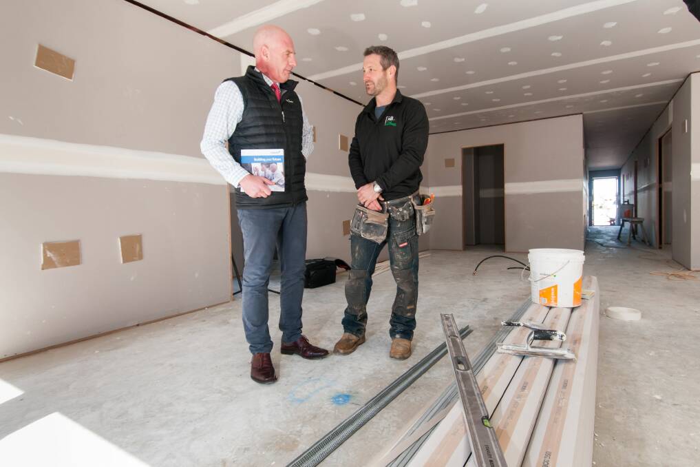 BUILDER: Treasurer Peter Gutwein and G&T Developments director Steve Graham discuss the construction sector at Prospect Vale. Picture: Phillip Biggs 