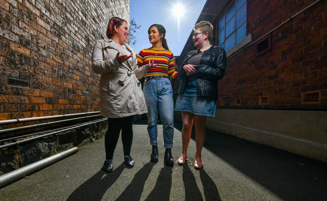 WORDSMITHS: Launceston heat winners Natasha Clarke, Brielle Quigley and Maggie Aitken prepare for the Tasmanian Poetry Slam final this weekend. Picture: Scott Gelston
