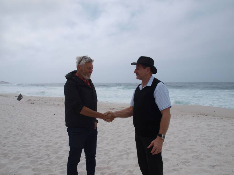 World Trail director Glen Jacobs and Break O’Day Council mayor Mick Tucker at Swimcart Beach, where one of the trails will finish. Picture: Supplied