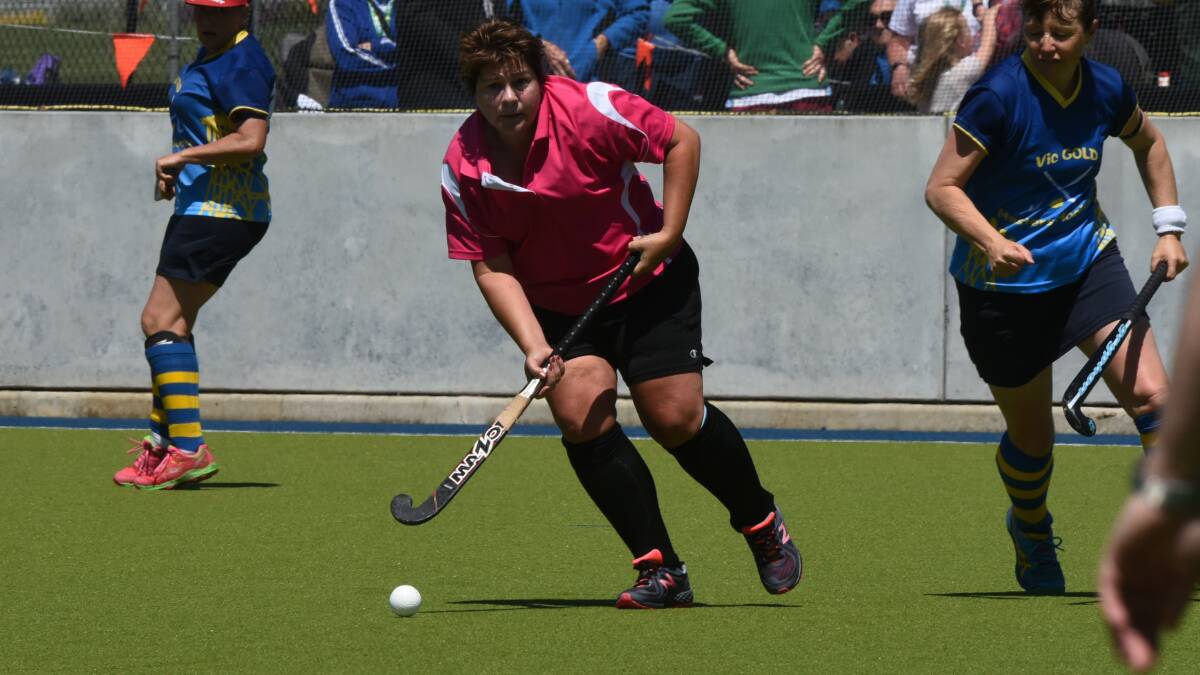 So close: Sharee Taylor of the Bee Gees in their 3-2 extra time loss in the women's over 45s gold medal game. Picture: Neil Richardson.  