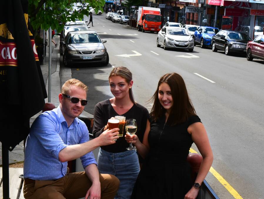 CITY CULTURE: Cityprom executive officer Steve Henty, O'Keefes Hotel's Chloe Babos and Cityprom's Laura Wilson prepare for Fiesta on George. Picture: Neil Richardson