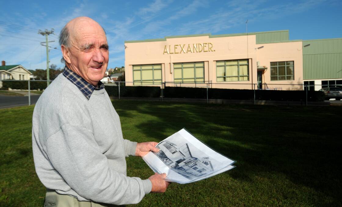 Mr Green with images of the first factory at the location of the original Alexander Patent Racket factory site. Picture: Geoff Robson