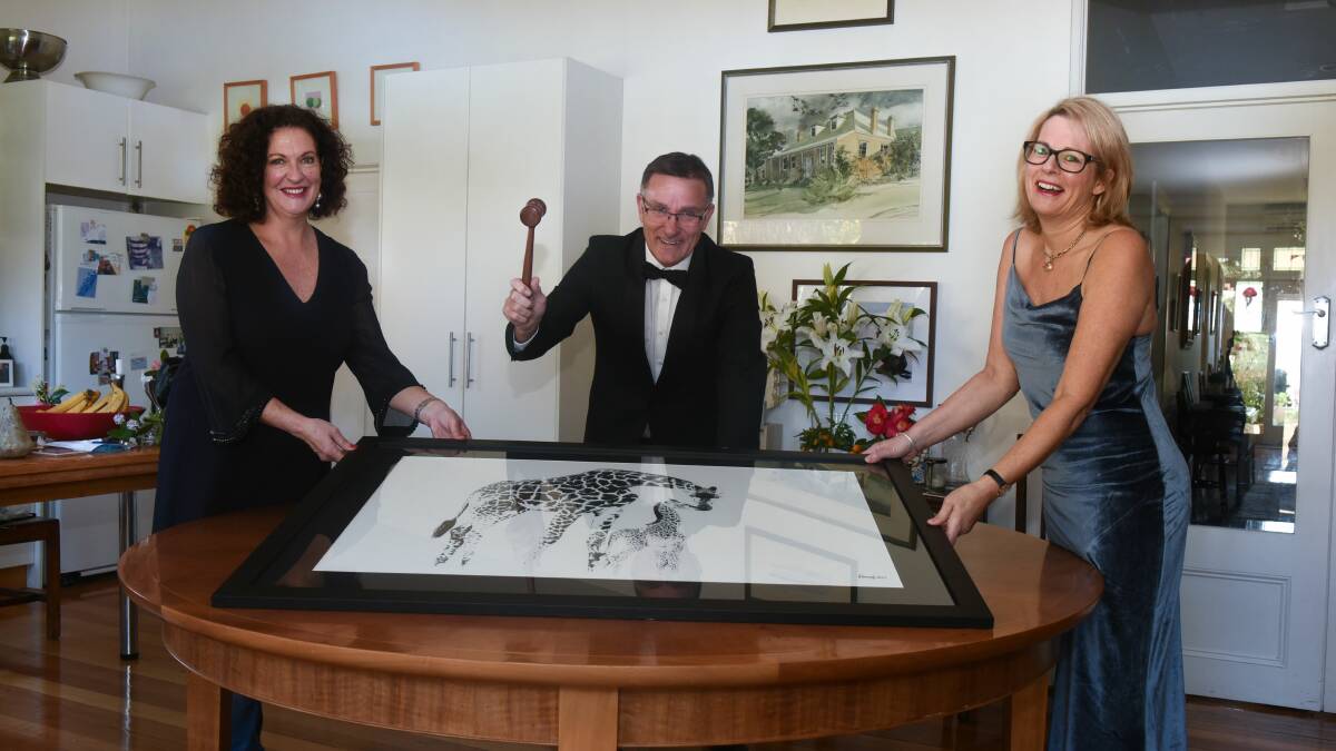 The Peter Hewitt Care for Africa Foundation Jenny Saunders, auctioneer David Jackson and charity chief executive officer Diana Butler prepare for The Care for Africa Cocktail Ball. Photographer Neil Richardson