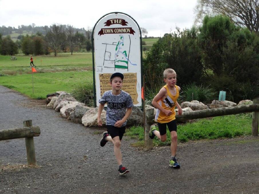 CROSS COUNTRY: Quinn Barker and Damon White run during last year's annual Westbury Races, which are all-inclusive. Family participation is encouraged to keep active while enjoying beautiful scenery. Picture: Sue Fowler