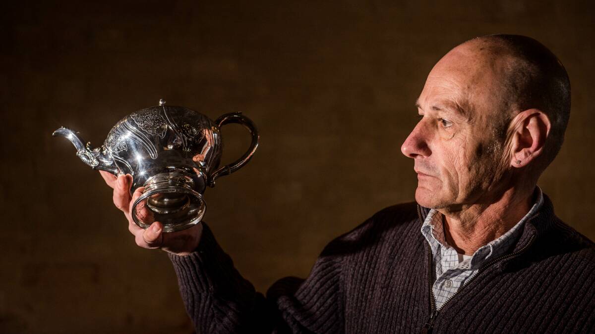 HIGH TEA: Tasmanian Antique Fair co-coordinator Robert Henley says for every Scottish silver teapot, 100 English teapots were made, which made this 1836 teapot created by Robert Gray and Son special. The decorations would have been done by hammering and chiseling, he says.