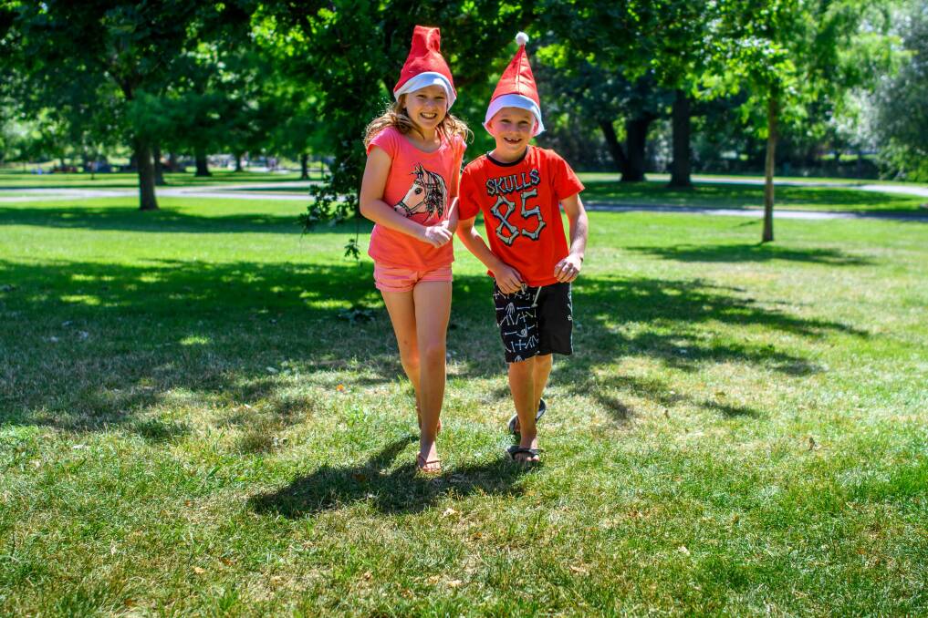 FINE FORECAST: Chelsea and Lee McCamley from Gladstone, Queensland, enjoy a run in City Park Launceston as they start their Christmas holiday in the state. Picture: Scott Gelston