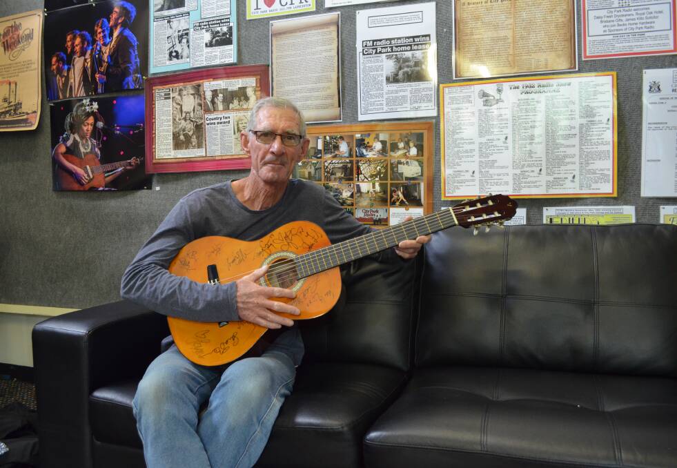 CHARITY: Stephen McCarthy, of Launceston, will put his Golden Guitar-signed guitar up for auction with all proceeds going to StGiles. Picture: Tess Brunton