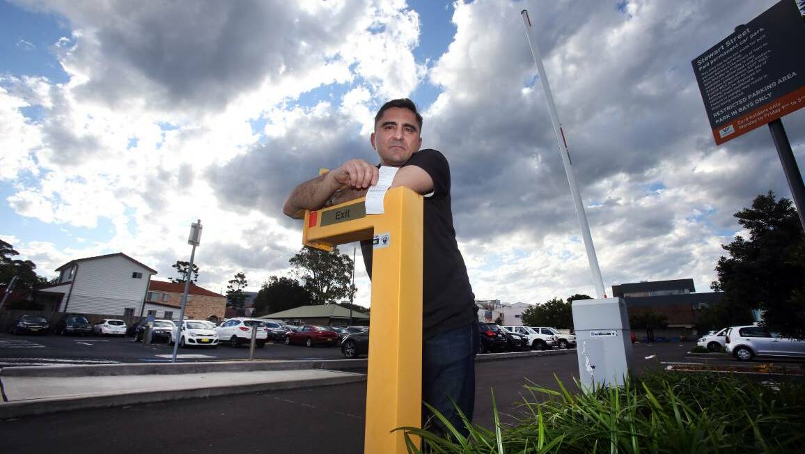 Chris Kizi pays for a space in Wollongong City Council car parks - but the monthly fee doesn't guarantee his space will always be available. Picture: Rob Peet
