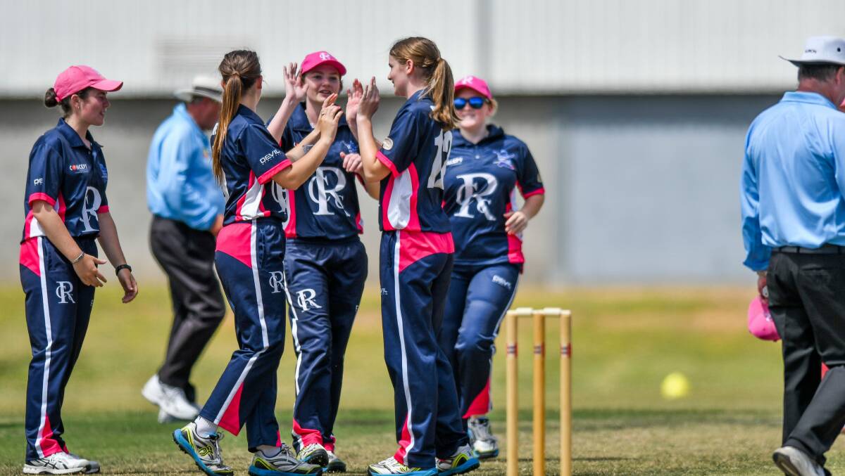 ONE DOWN: Riverside teammates get around wicket-taker Elyse Page to celebrate a Wynyard dismissal in Sunday's T20 game at the NTCA No.2 Ground. Picture: Scott Gelston