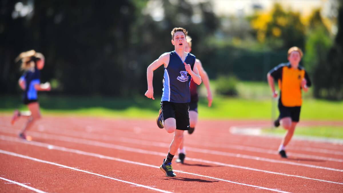 RUSH HOME: Marist Regional College's Tarj Singleton wins the under-13 200m at the NSATIS athletics carnival in Launceston.