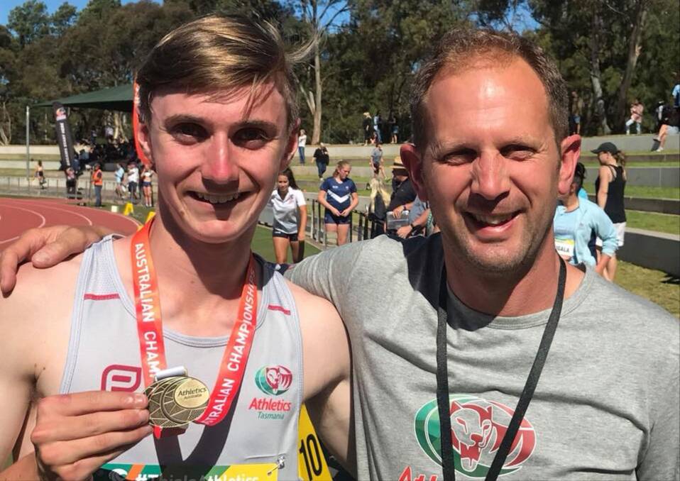 WELL RESTED: Riverside teenager Sam Clifford stands proudly with Tasmanian team manager Stuart Miller after winning national gold in Adelaide and continuing his recent run of smashing another state record at the Australian All Schools Championships. Picture: Nathan McKillop