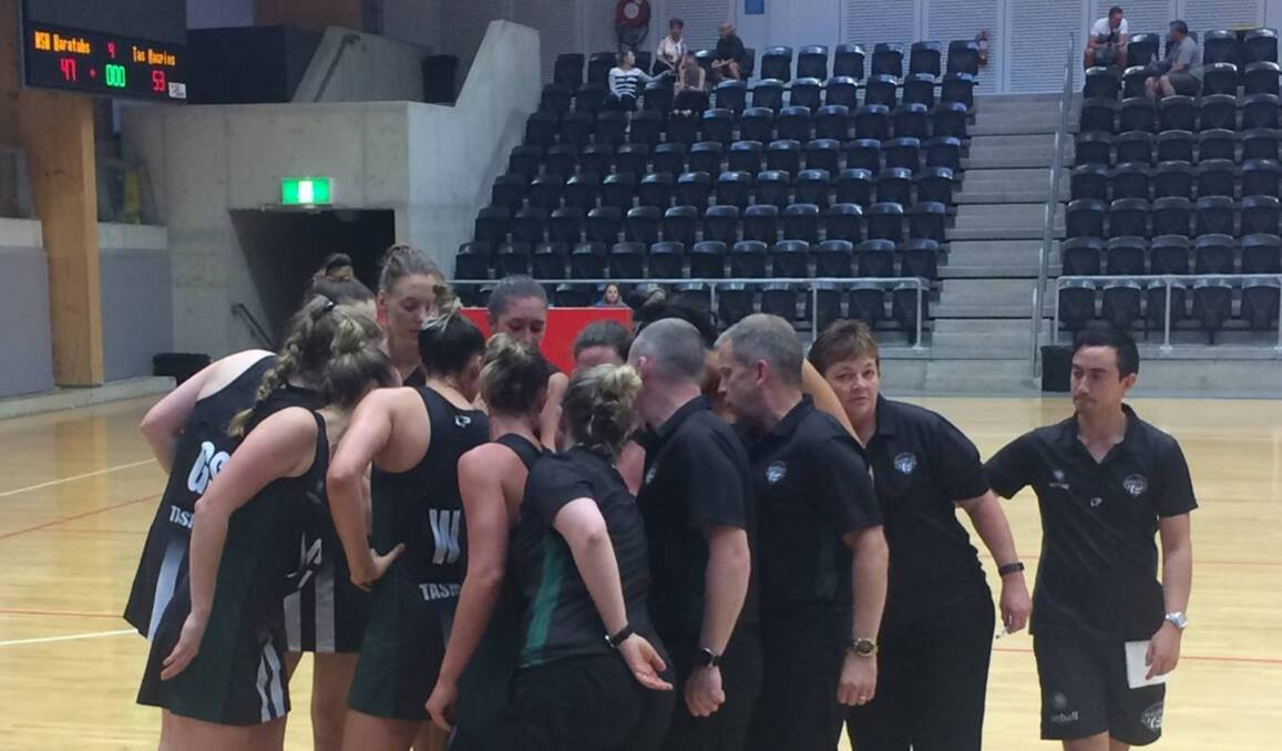 WINNERS: Tasmanian Magpies, including team manager Ann Pearce, second from the right, celebrate the first of their two wins over Netball NSW Waratahs on Saturday in Sydney. Picture: Netball Tasmania