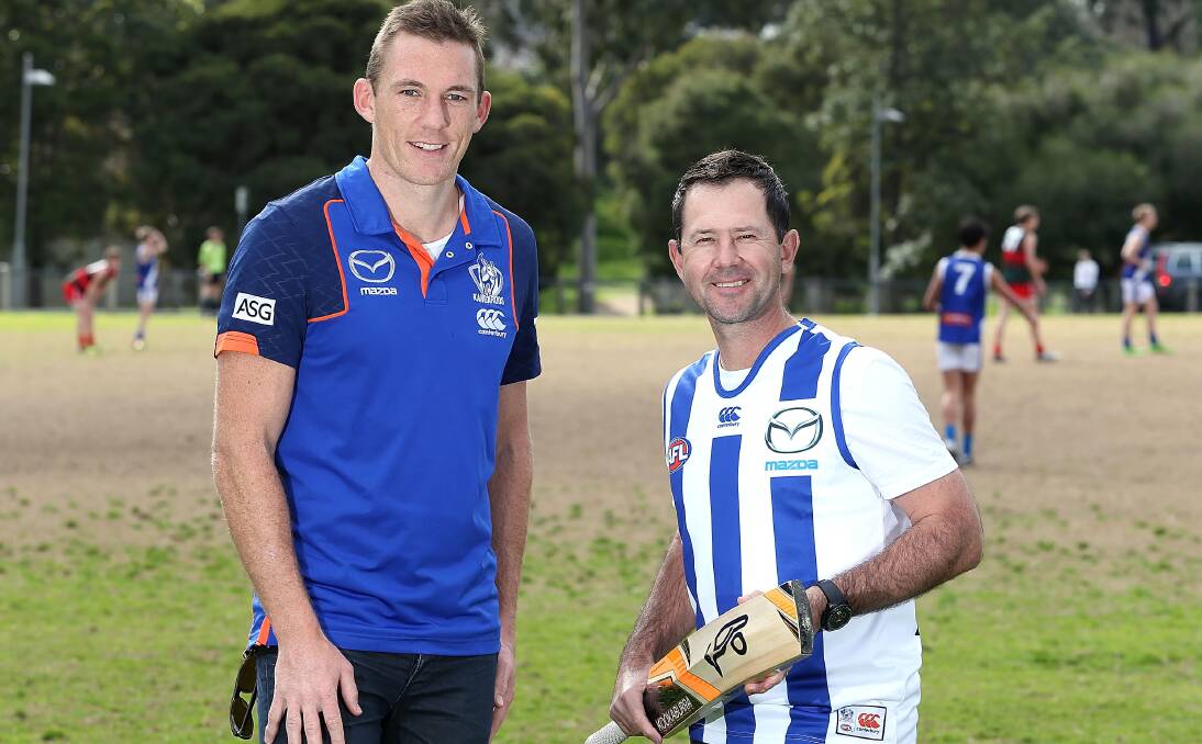 RULED OUT: Mowbray's former Australian captain Ricky Ponting farewells his North Melbourne cricket teammate Drew Petrie, who was ineligible for the charity cricket game after being drafted to the West Coast Eagles.