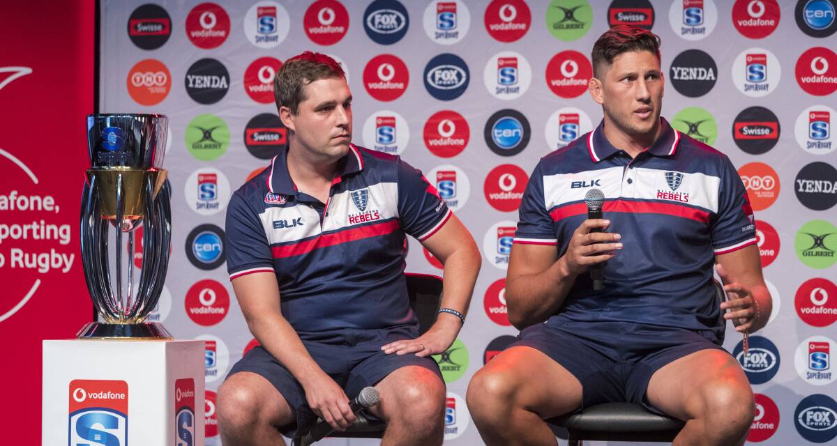 LANDMARK: Tasmanian-raised Adam Coleman, who was announced the new Melbourne Rebels captain, discusses the Super Rugby season ahead as coach Dave Wessels looks on during the club launch on Sunday. Picture: AAP