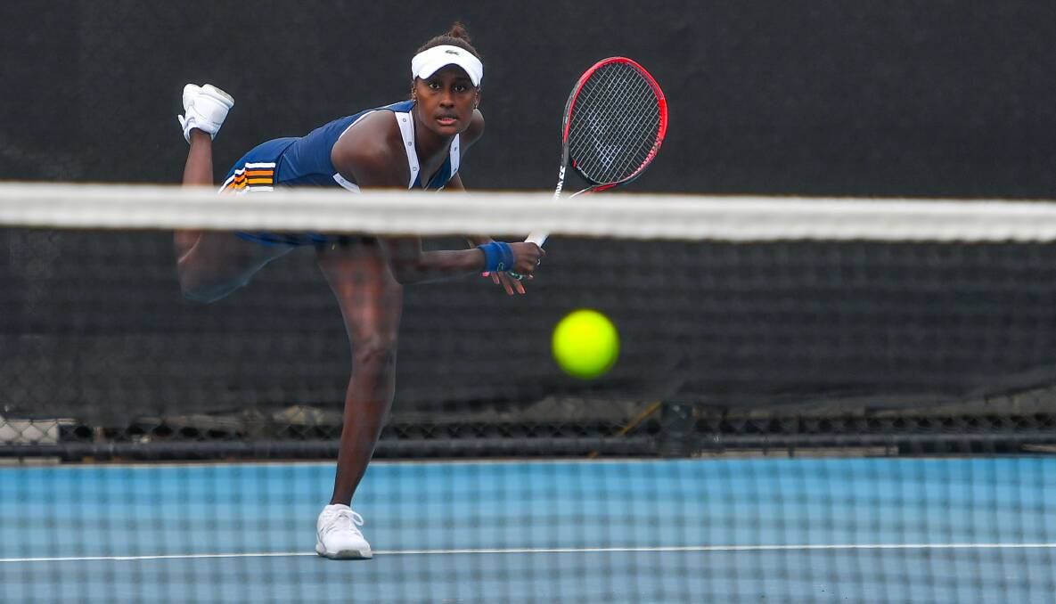 SERVING IT UP: American Asia Muhammad delivers one of her best against Ellen Perez. Picture: Scott Gelston