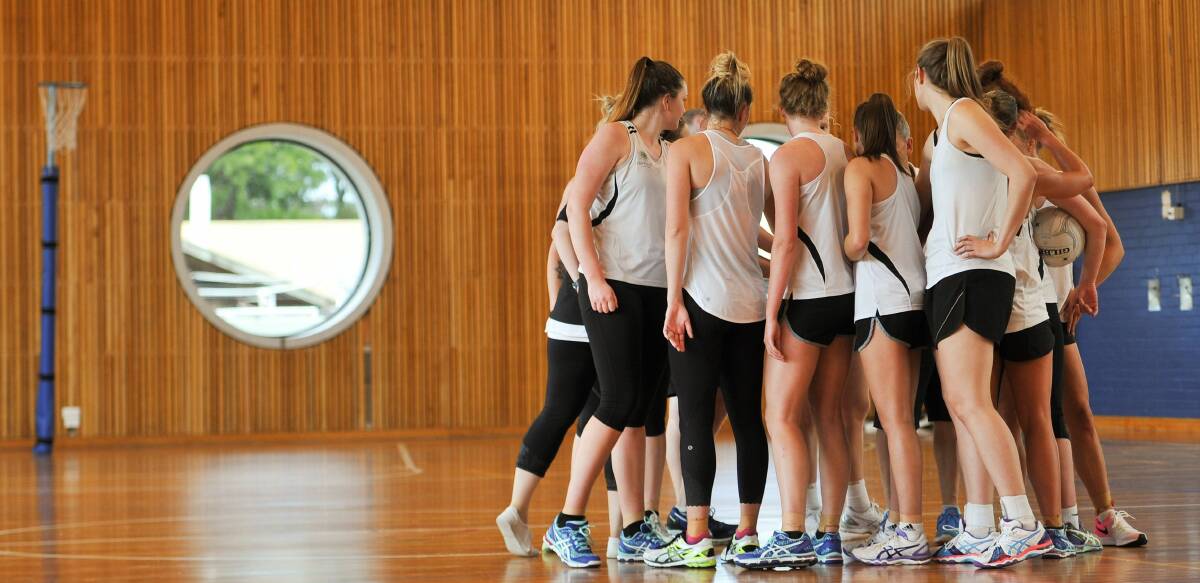 GO TEAM: Tasmanian Magpies gather again for one last instruction during their Launceston training session. Picture: Scott Gelston