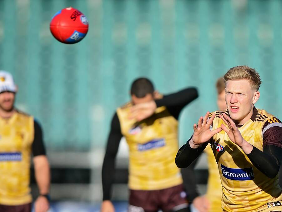 ON THE LEAD: Hawthorn rising forward James Sicily gets some last marking practice at Friday's training session at Aurora Stadium.