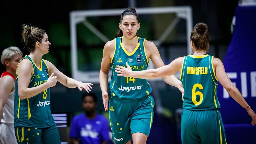 AUSSIES UNITE: Mansfield offers a high five to teammate Marianna Tolo. Picture: FIBA.com