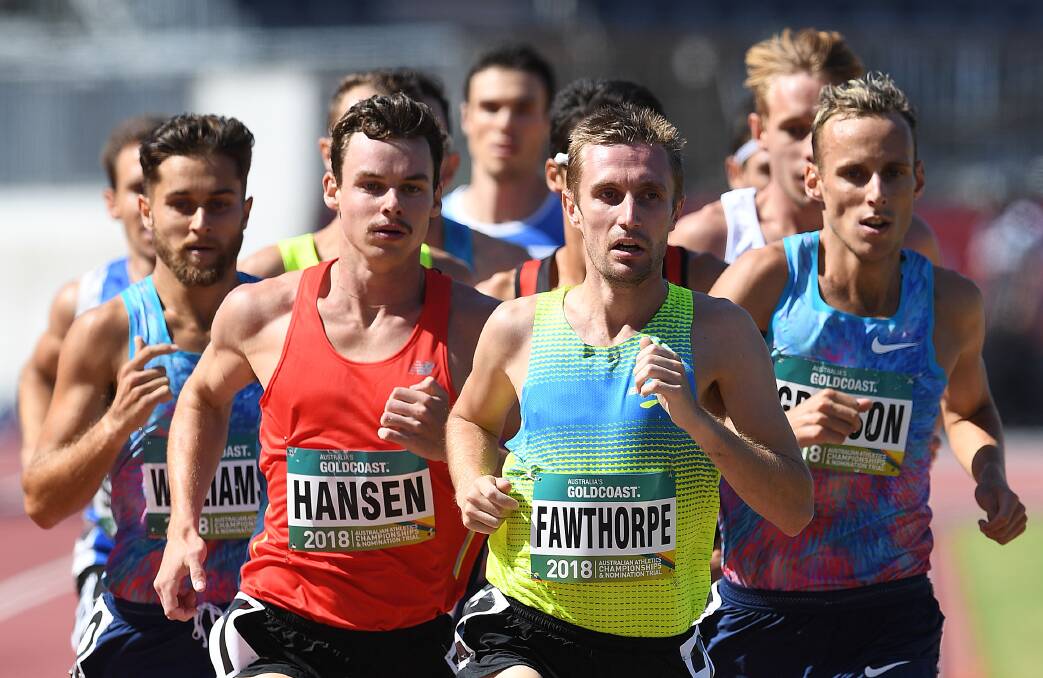 Red flag: Launceston's James Hansen on the shoulders of Victorians Tom Fawthorpe and eventual winner Ryan Gregson in the 1500m final on the Gold Coast. Picture: AAP