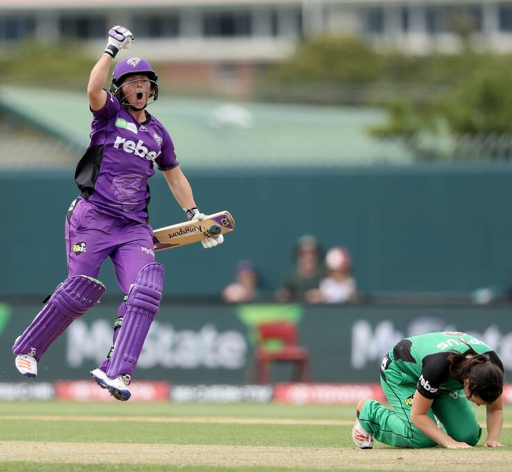 JOY: Hurricane Corrine Hall pumps the air after hitting the winning runs off Melbourne Stars seamer Gemma Triscari. Picture: Getty Images
