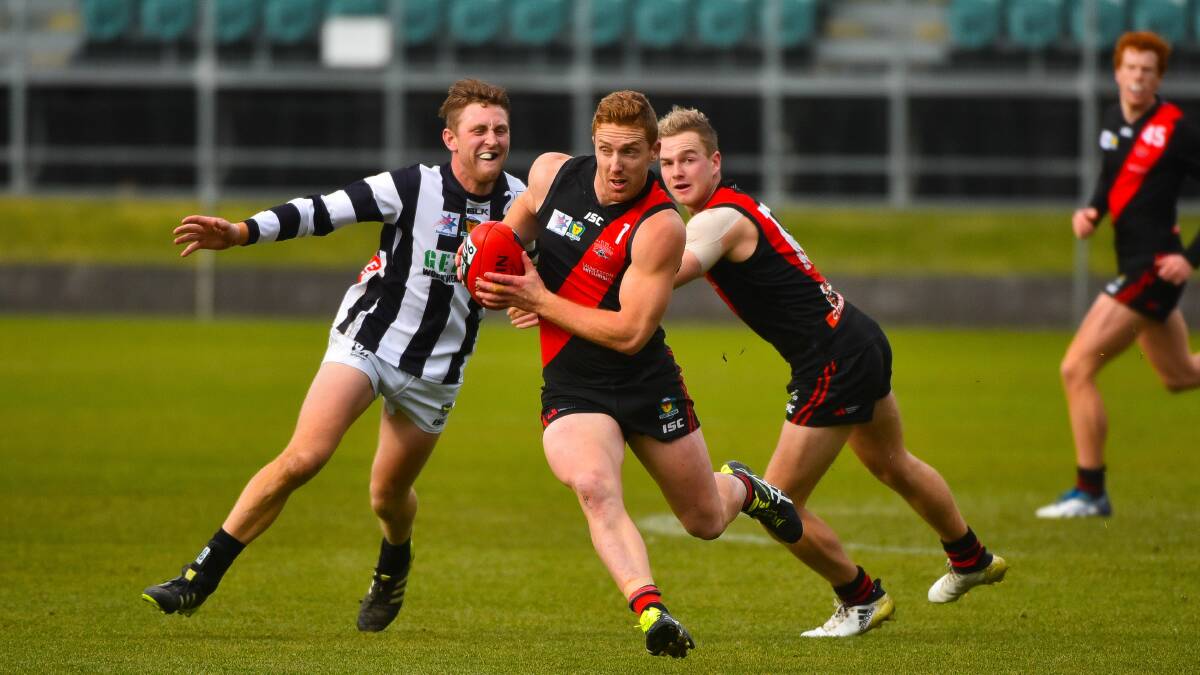 ELUSIVE: North Launceston's Brad Cox-Goodyer eludes a Glenorchy opponent on his way to a best-on-ground game at UTas Stadium on Saturday against last year's TSL premiers. Picture: Scott Gelston