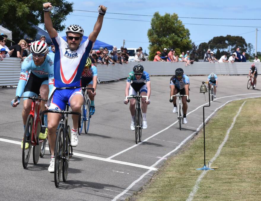 VICTORIOUS: Veteran cyclist Simon Price raises his arms in the air, jubilant in crossing the line first in the men's St Helens wheelrace on Saturday. Pictures: Neil Richardson