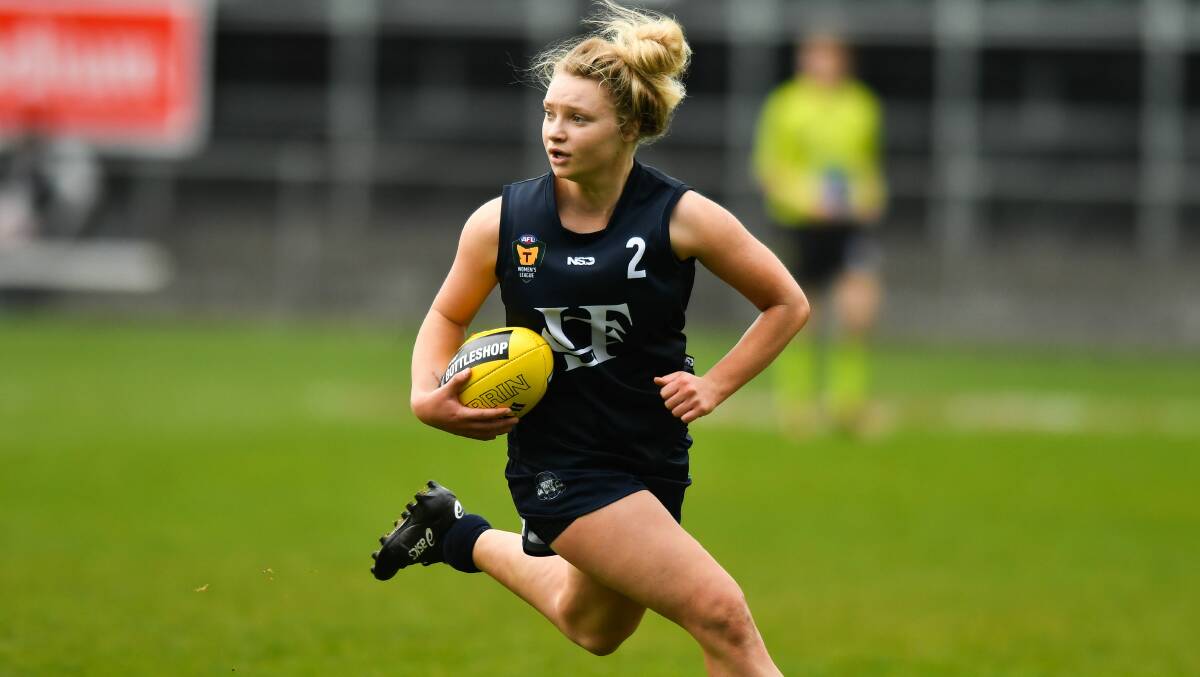 MAKING HER MOVE: Launceston playmaker Daria Bannister shows the sort of dash in the TSLW grand final that could attract AFLW recruiters. Pictures: Scott Gelston