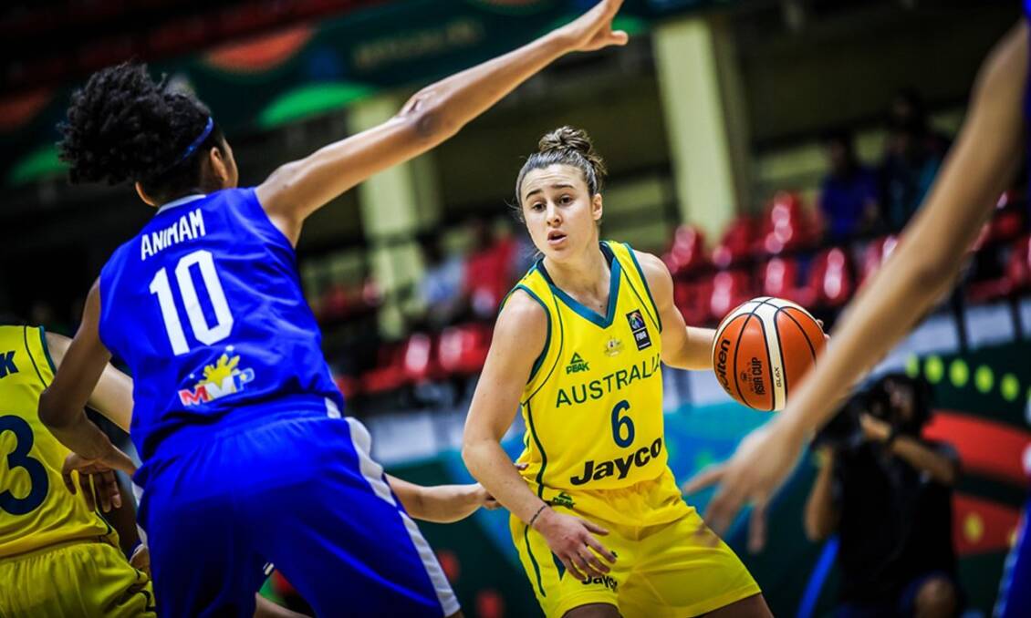 FINDING GAPS: Launceston point guard Lauren Mansfield thinks her way through the Filipino defence on Monday's Asia Women's Cup match in India. Picture: FIBA.com