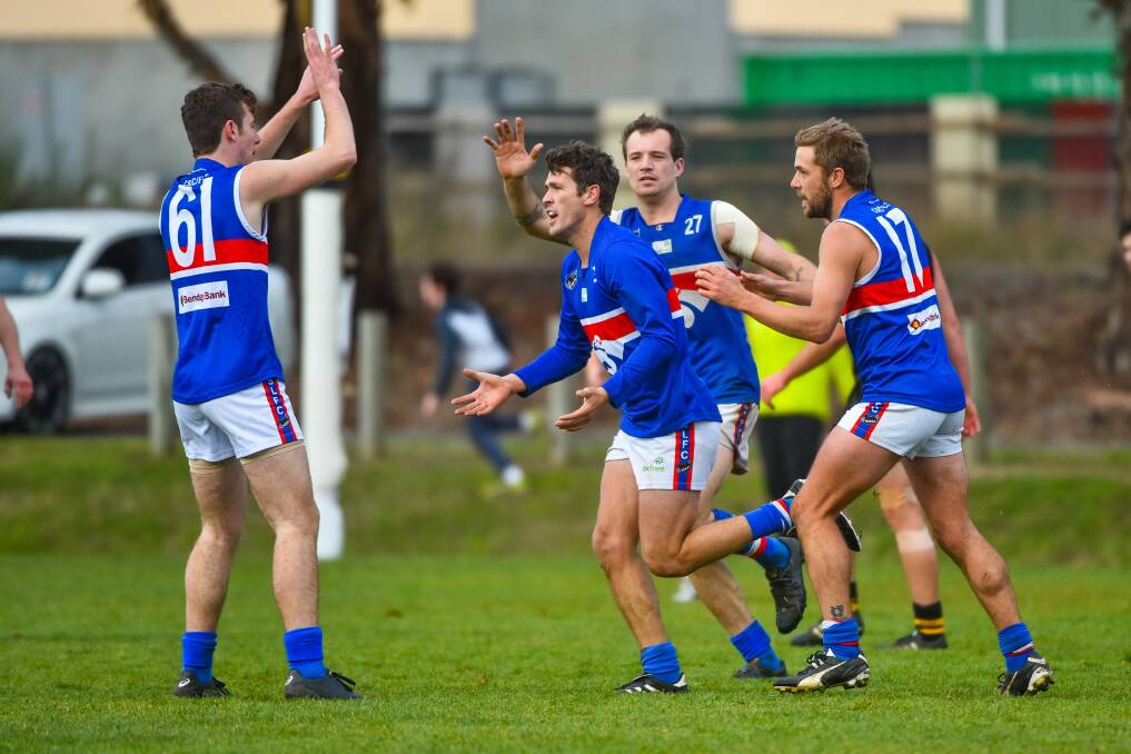 HAPPY TIMES: Adam Viney celebrates a goal with South Launceston teammates until a broken collarbone ruled him out of the Bulldogs grand final. Picture: Scott Gelston