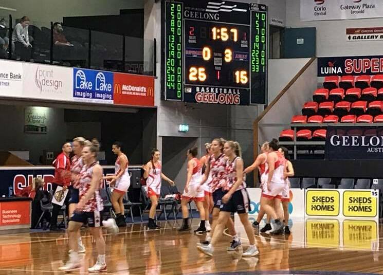 TAKE A BREAK: Launceston Tornadoes and Geelong Supercats file to their benches during the quarter-time interval. Picture: Geelong Supercats.