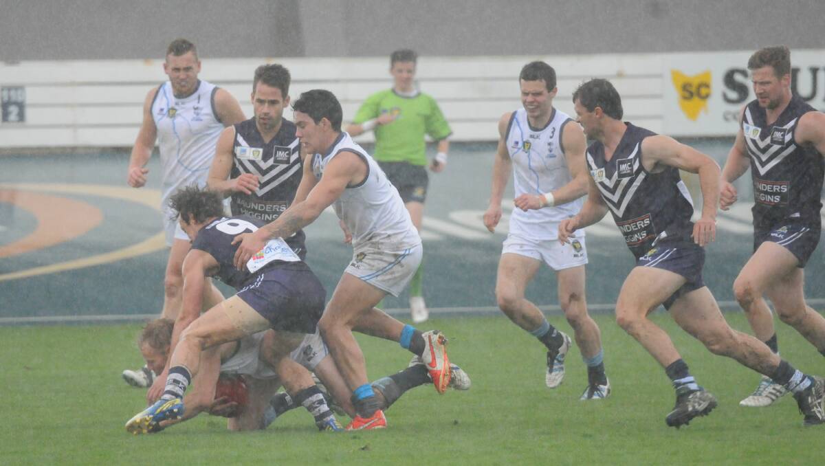 HAZY PAST: Home side Burnie ironically battle now defunct TSL side Western Storm in typically miserable conditions at West Park back in the 2014 season. Picture: Paul Scambler