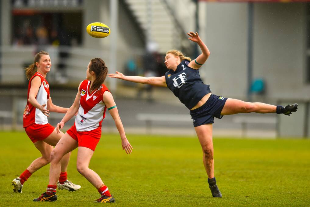 WITHIN ARM'S REACH: Launceston star Daria Bannister typifies her side's desperation, handing the Blues a win over Clarence to set up a grand final berth. Picture: Scott Gelston