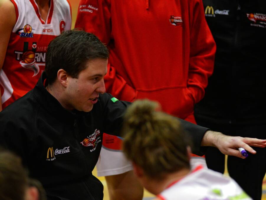 LISTEN UP: Launceston Tornadoes coach Reece Potter addresses his troops during a break in the game against the Geelong Supercats.